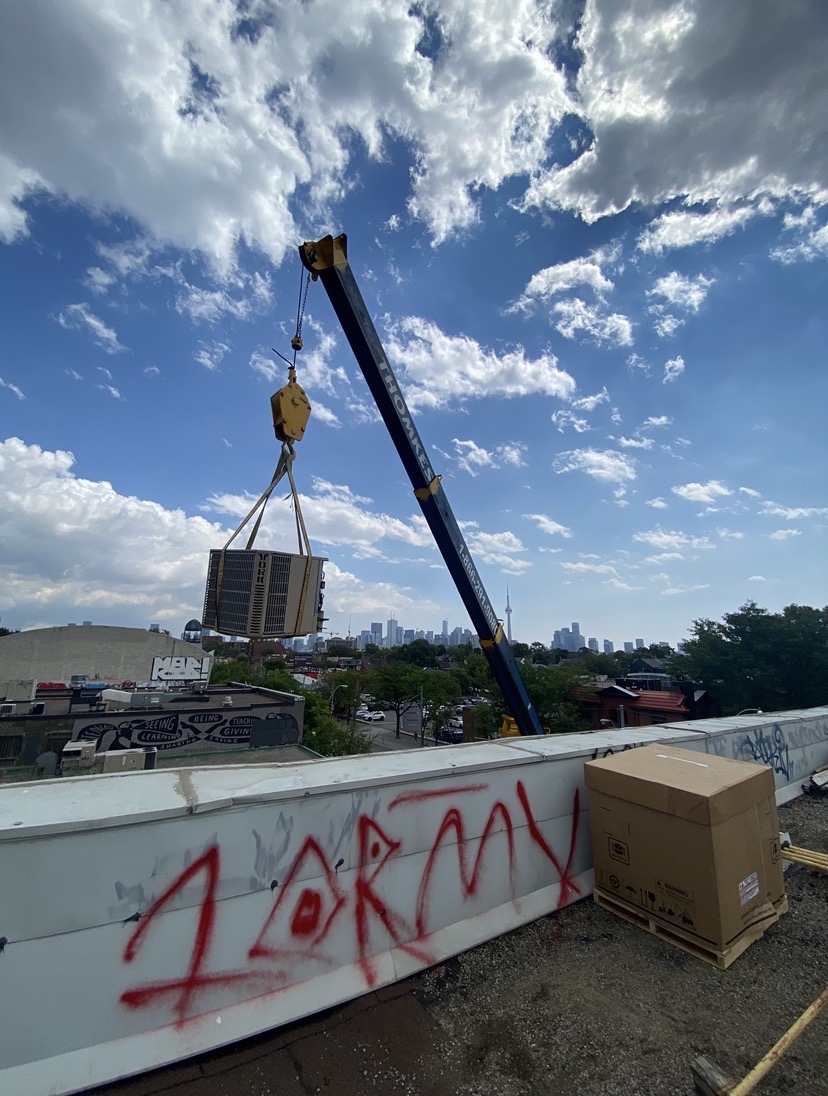 ABCON Air Systems technician servicing rooftop HVAC equipment